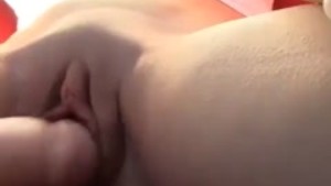 Blonde fucks herself in daylight at California beach